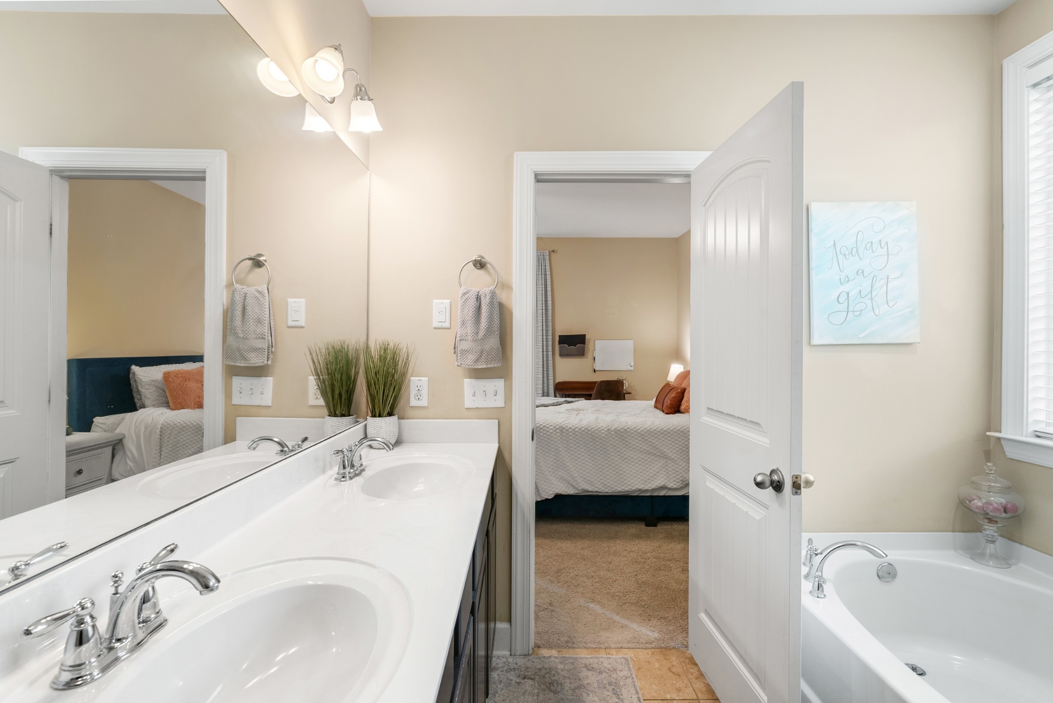 2014 Morton Drive Spring Hill, TN 37174 - Photo 24 of 44 a en suite bathroom with a double vanity sink tub and mirror