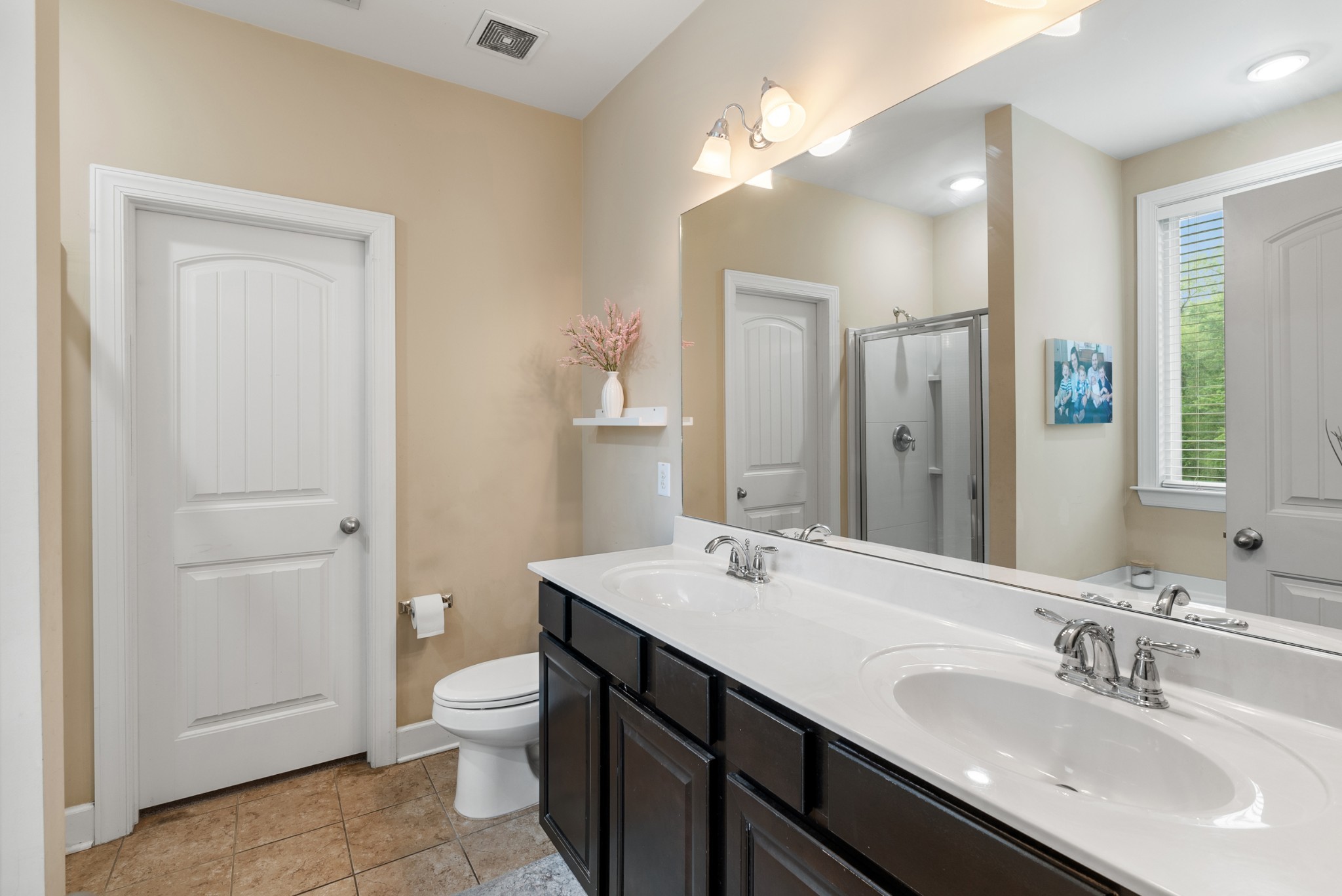 2014 Morton Drive Spring Hill, TN 37174 - Photo 25 of 44 a bathroom with a double vanity sink toilet and a mirror