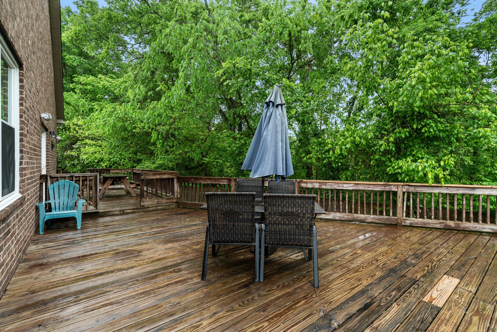 2014 Morton Drive Spring Hill, TN 37174 - Photo 39 of 44 a view of deck with table and chairs a barbeque with wooden floor and fence