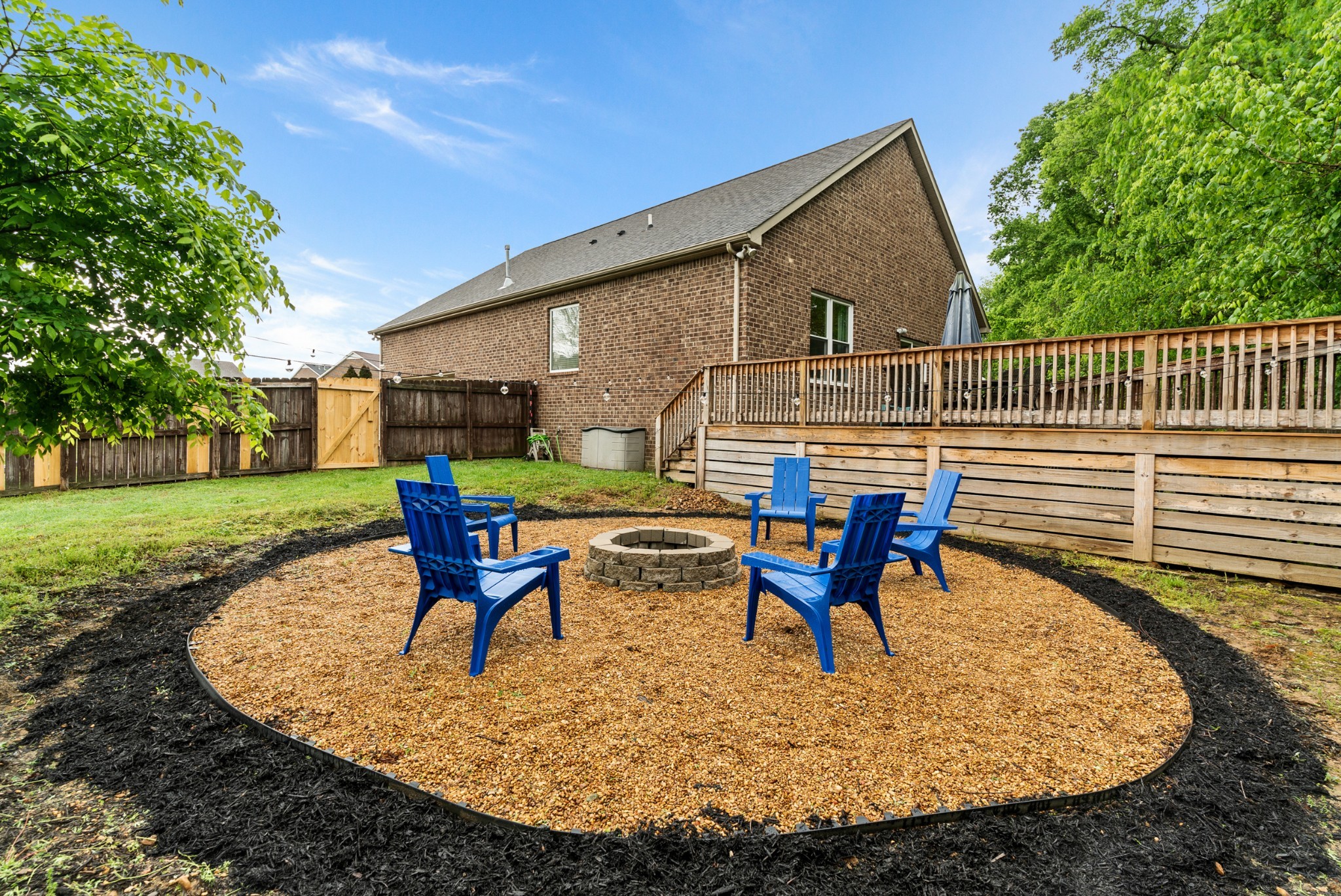 2014 Morton Drive Spring Hill, TN 37174 - Photo 42 of 44 a view of a house with backyard sitting area and garden