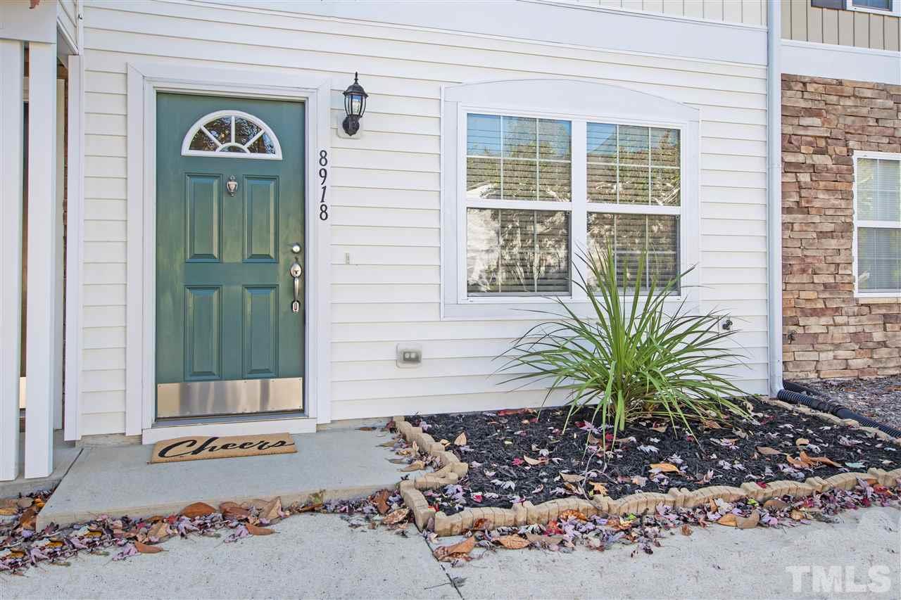8918 Thornton Garden Lane Raleigh, NC 27616 - Photo 2 of 26 a view of a door with a potted plant