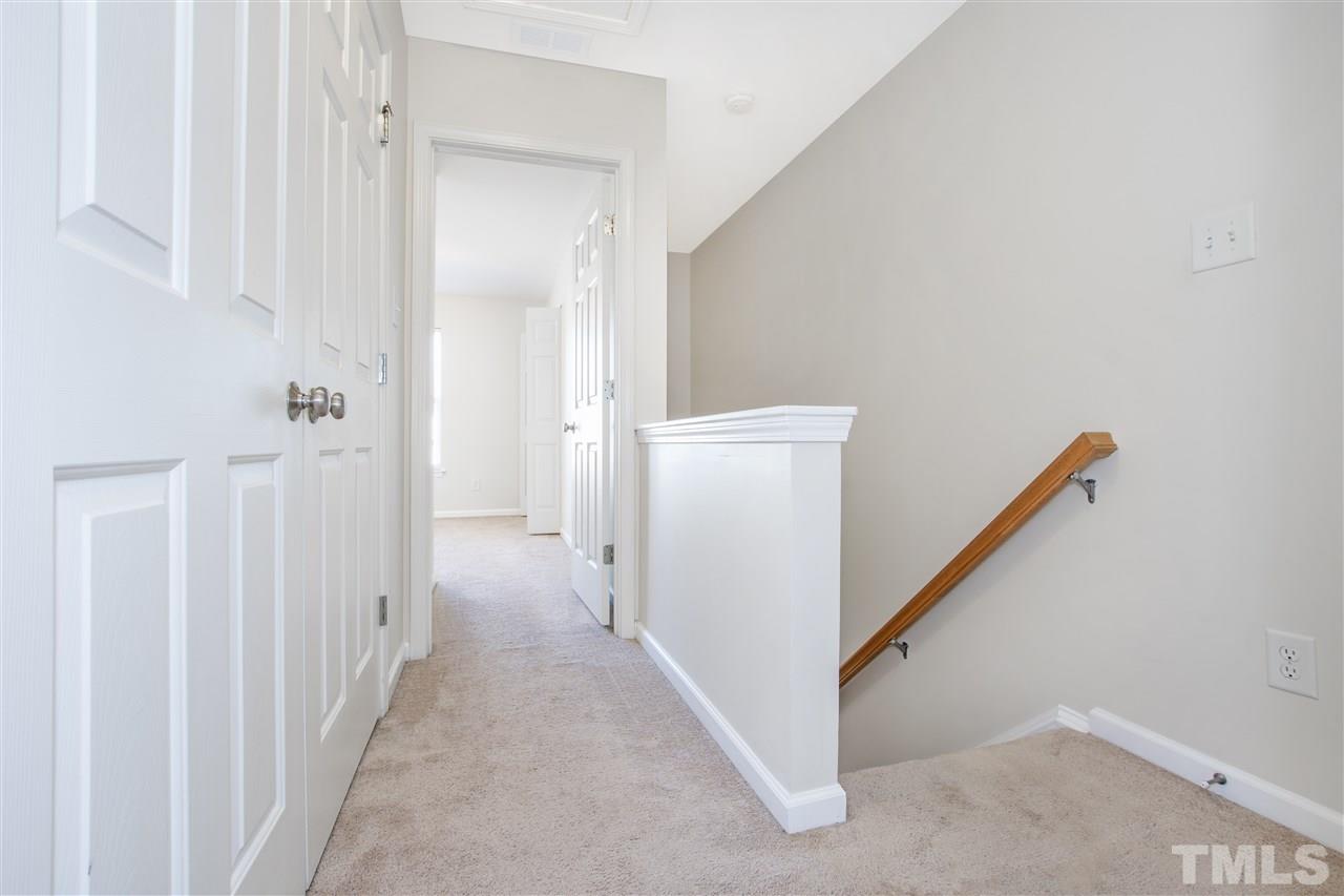 8918 Thornton Garden Lane Raleigh, NC 27616 - Photo 11 of 26 a view of a hallway with closet