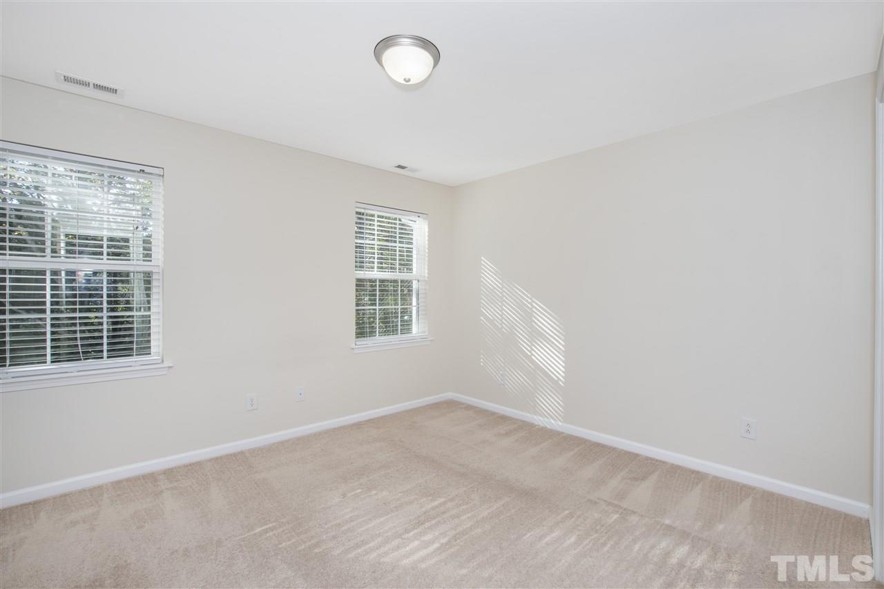 8918 Thornton Garden Lane Raleigh, NC 27616 - Photo 13 of 26 an empty room with a window