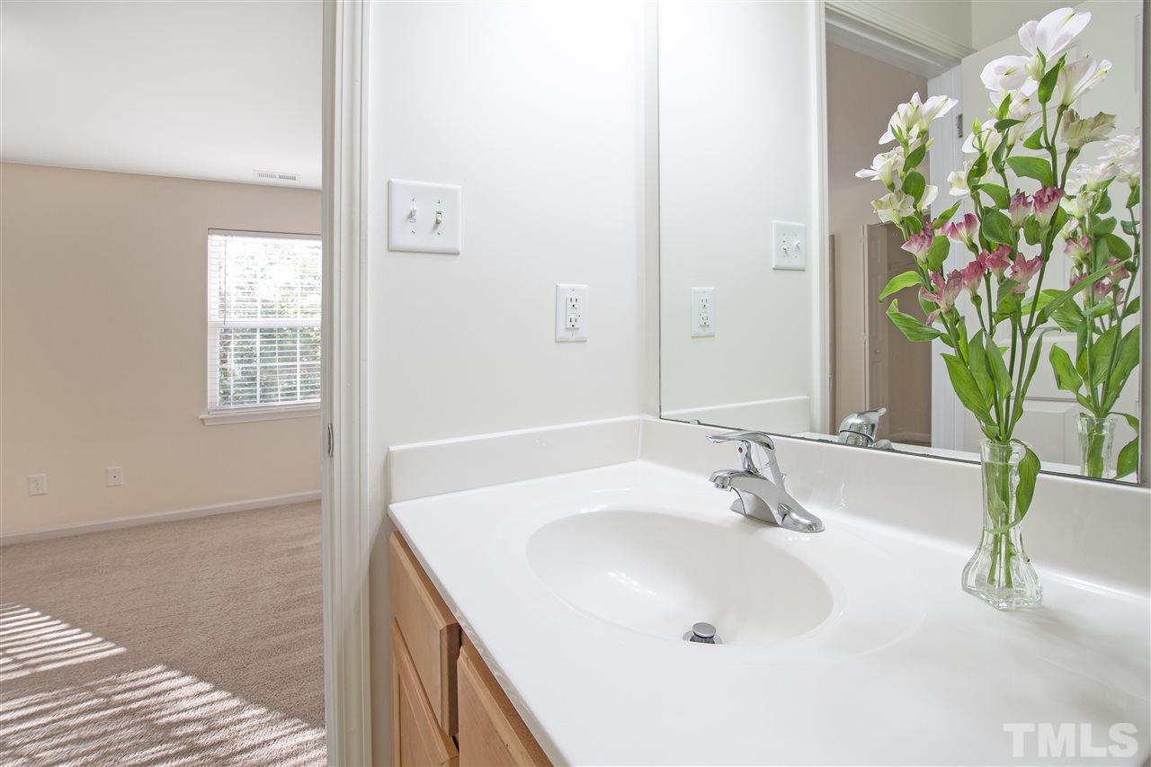 8918 Thornton Garden Lane Raleigh, NC 27616 - Photo 14 of 26 a bathroom with a sink and a mirror
