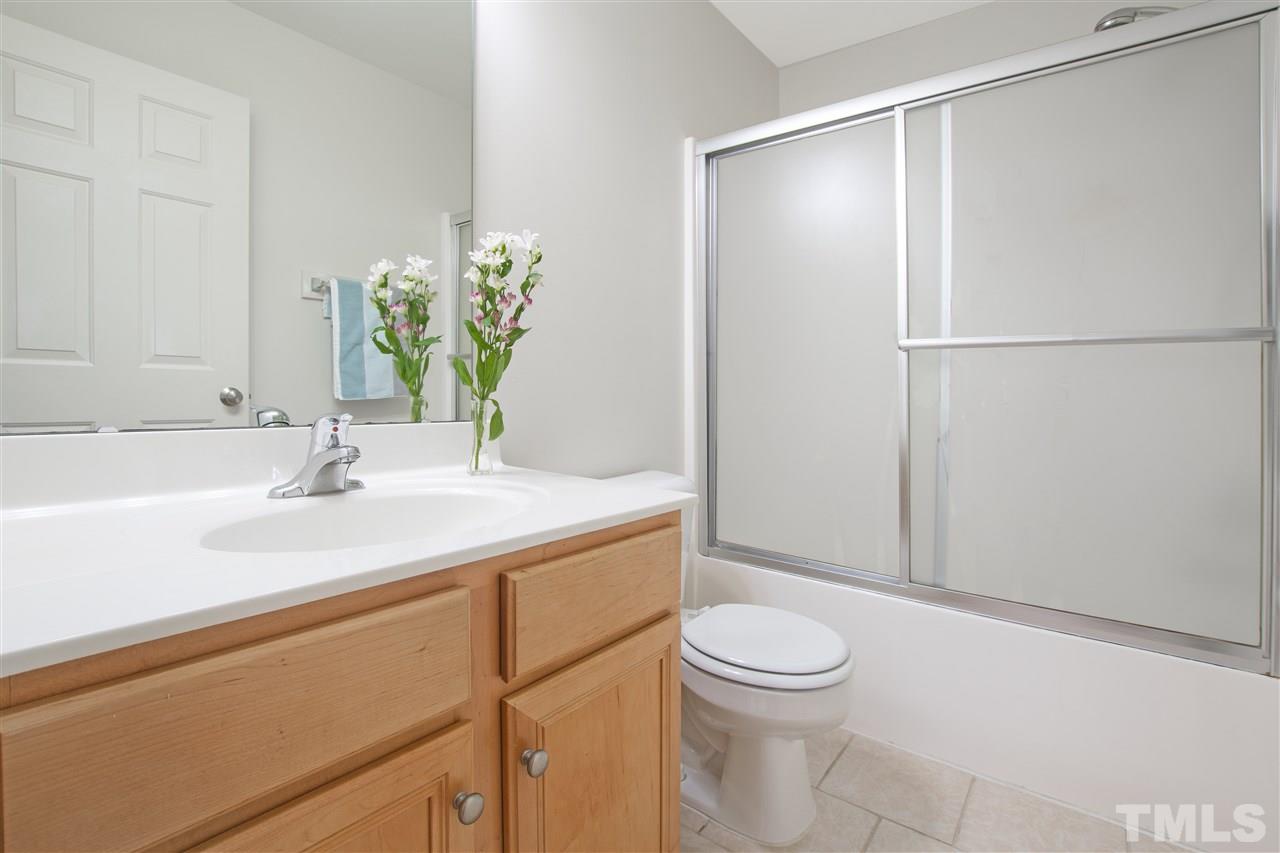 8918 Thornton Garden Lane Raleigh, NC 27616 - Photo 15 of 26 a bathroom with a sink a toilet and shower