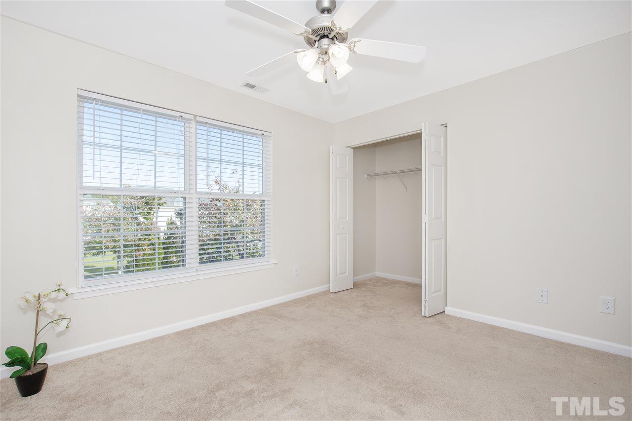 8918 Thornton Garden Lane Raleigh, NC 27616 - Photo 16 of 26 a view of an empty room with a window