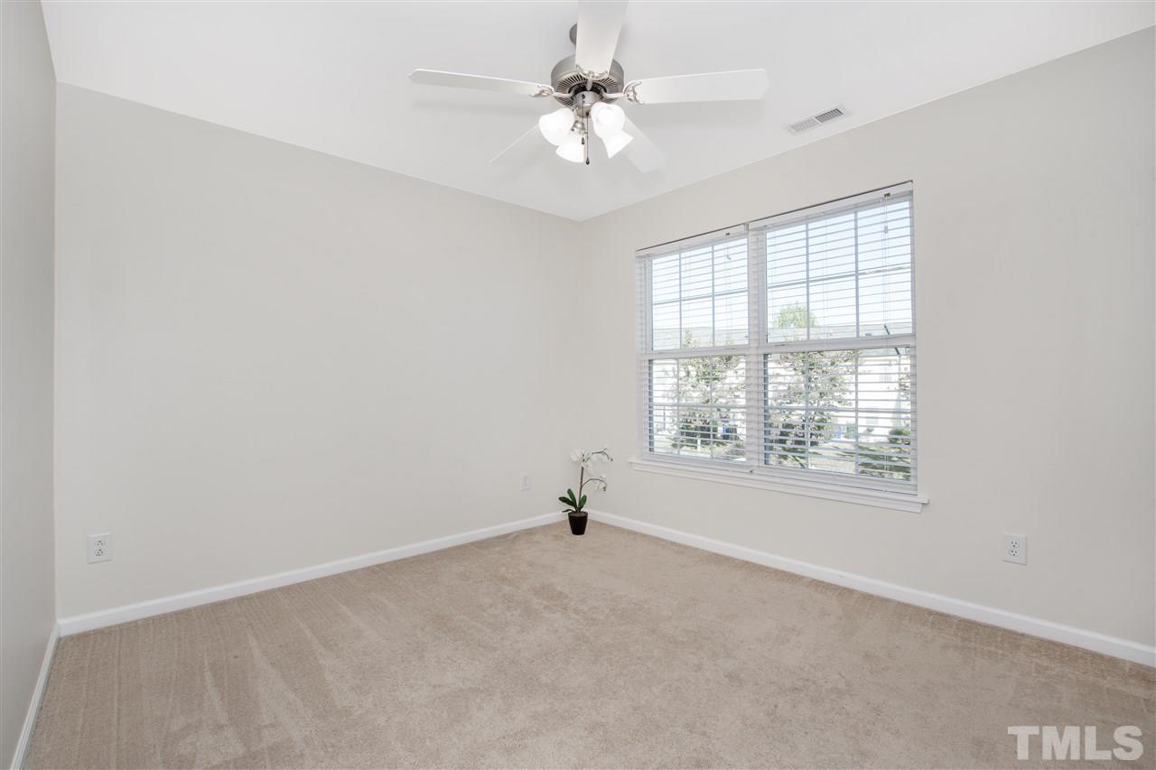 8918 Thornton Garden Lane Raleigh, NC 27616 - Photo 17 of 26 a view of an empty room with a window