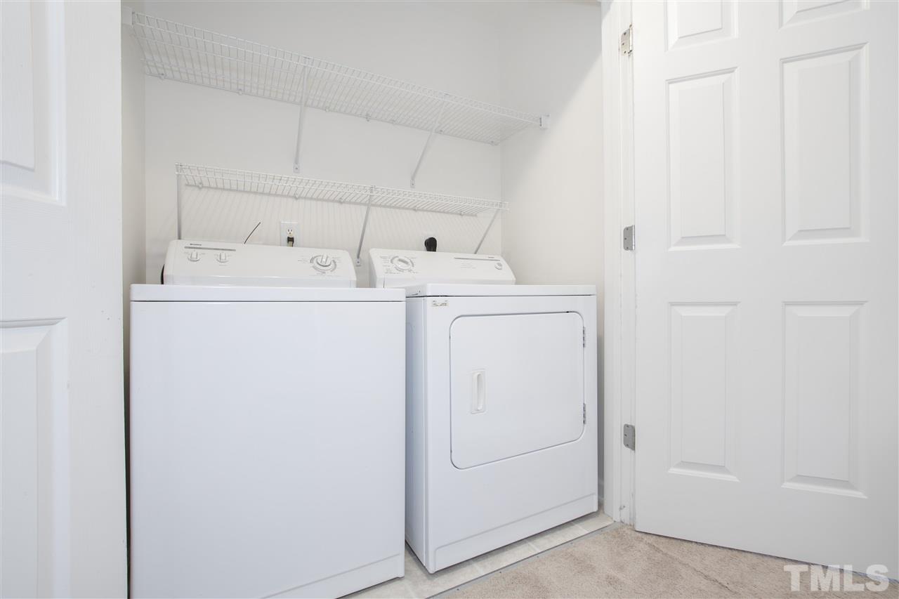 8918 Thornton Garden Lane Raleigh, NC 27616 - Photo 20 of 26 a utility room with dryer and washer