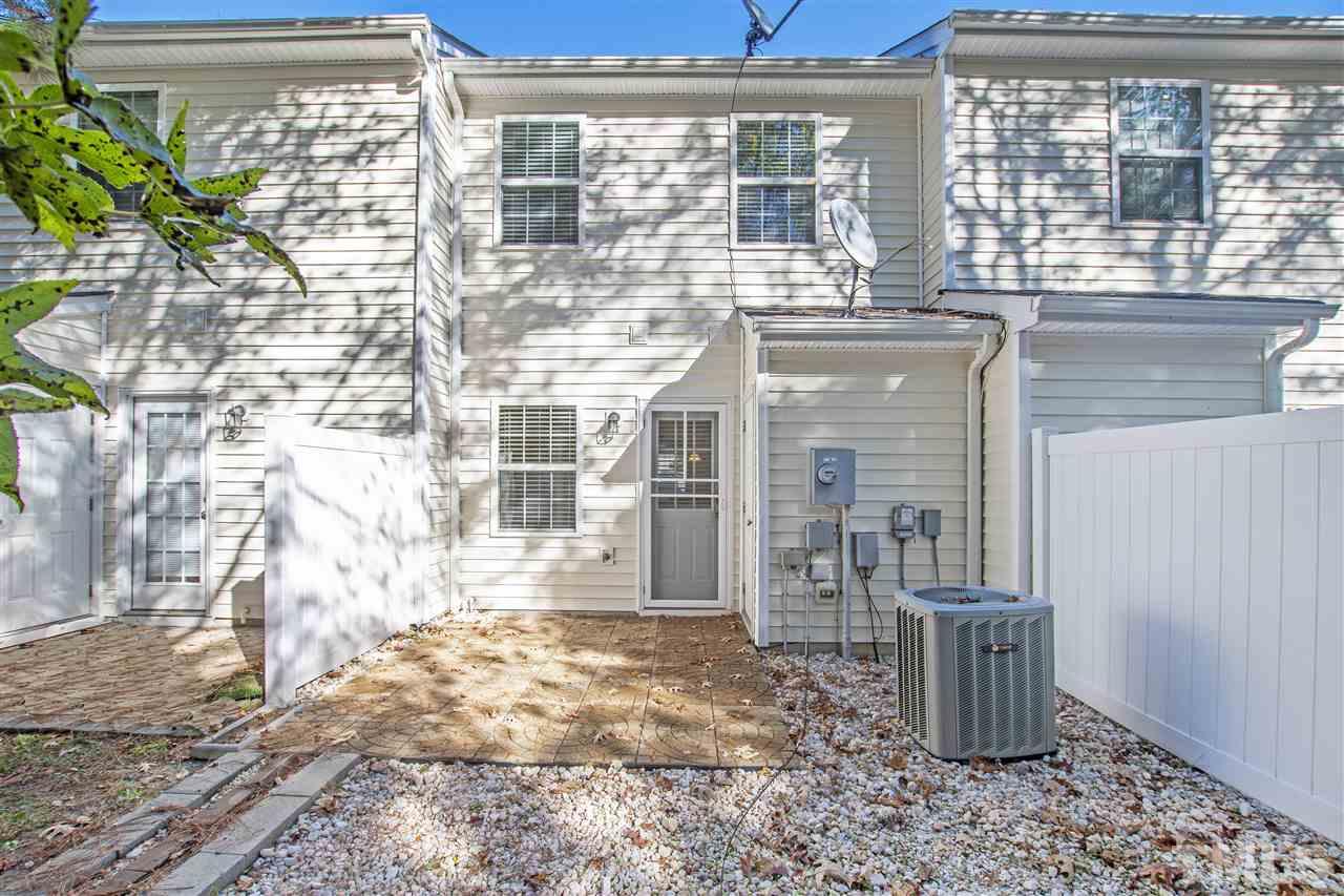 8918 Thornton Garden Lane Raleigh, NC 27616 - Photo 21 of 26 a front view of a house with outdoor seating