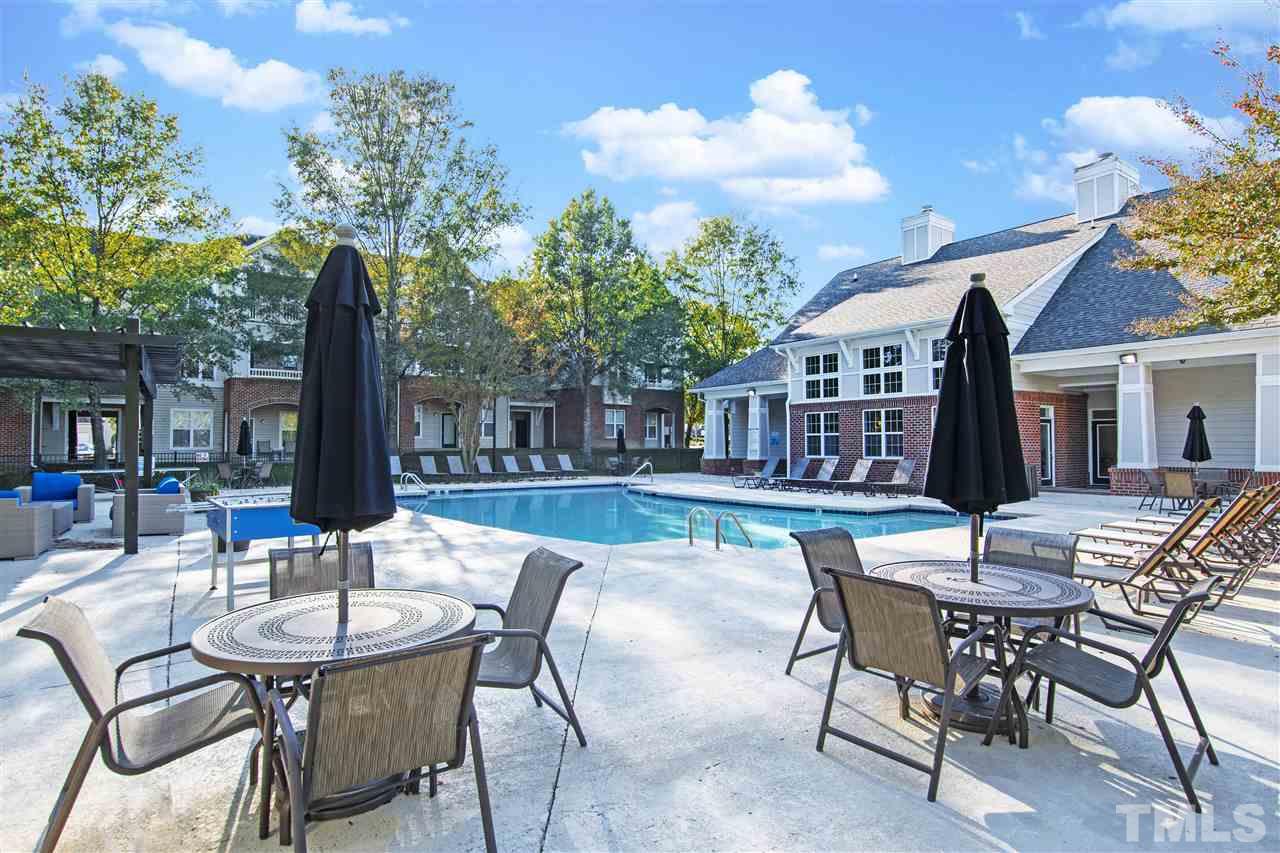 8918 Thornton Garden Lane Raleigh, NC 27616 - Photo 24 of 26 a view of a house with backyard and sitting area