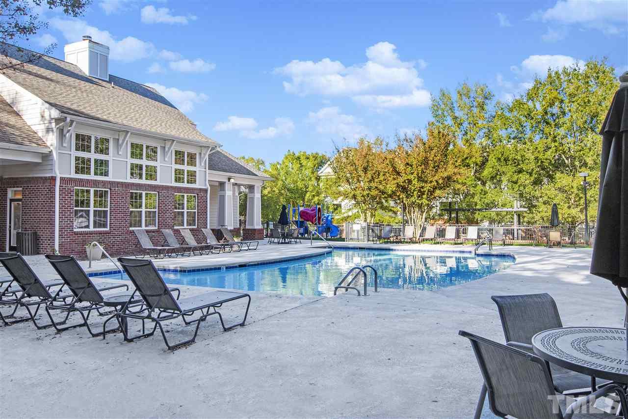 8918 Thornton Garden Lane Raleigh, NC 27616 - Photo 25 of 26 a view of a patio with table and chairs and potted plants