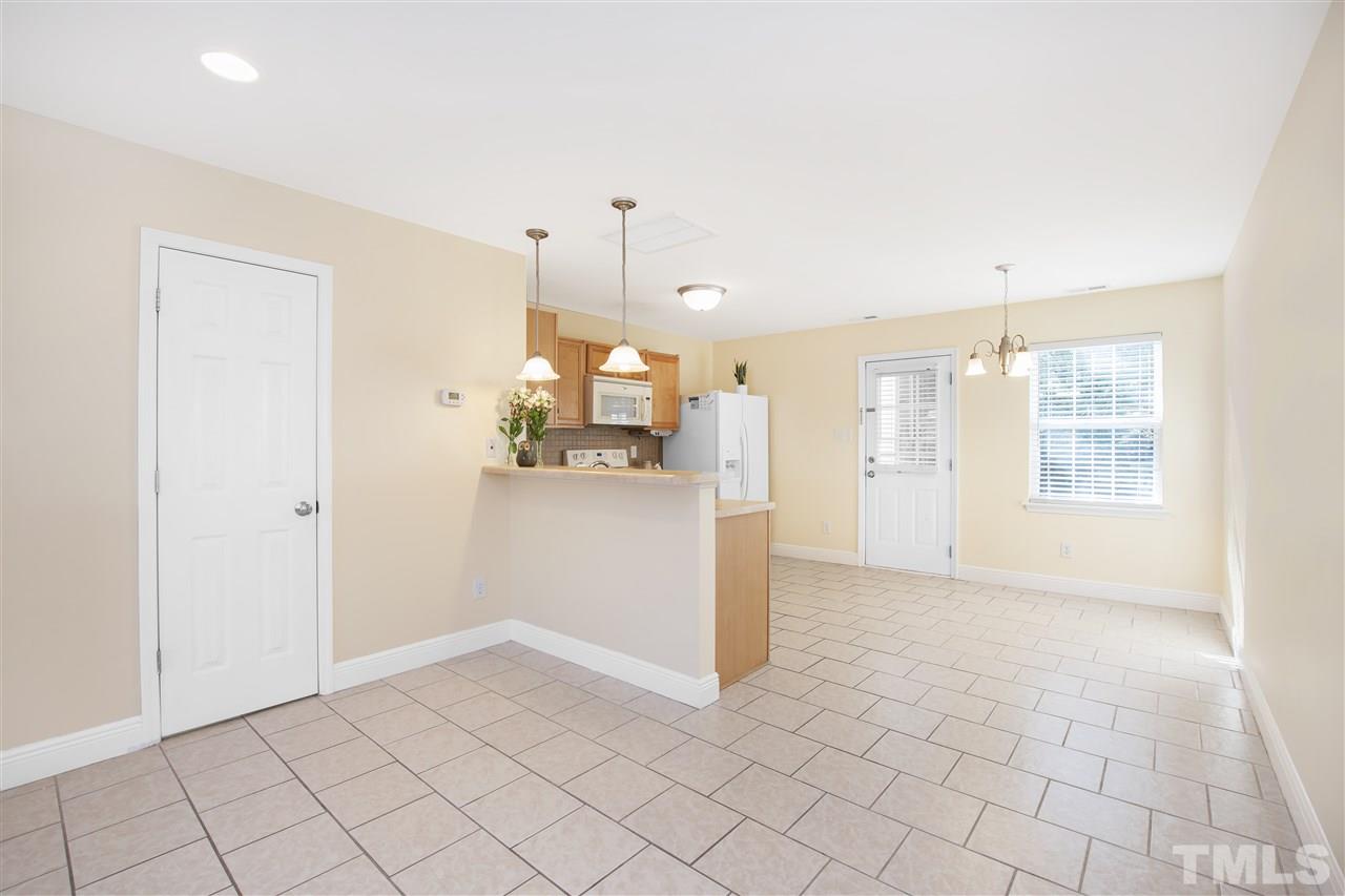 8918 Thornton Garden Lane Raleigh, NC 27616 - Photo 7 of 26 a view of a kitchen with a sink and a window