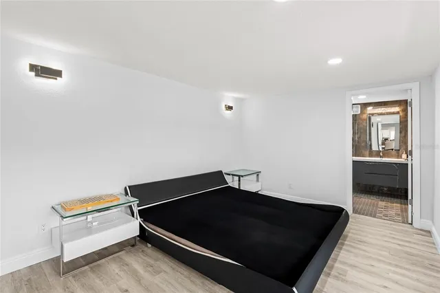 a living room with a bed furniture and a window