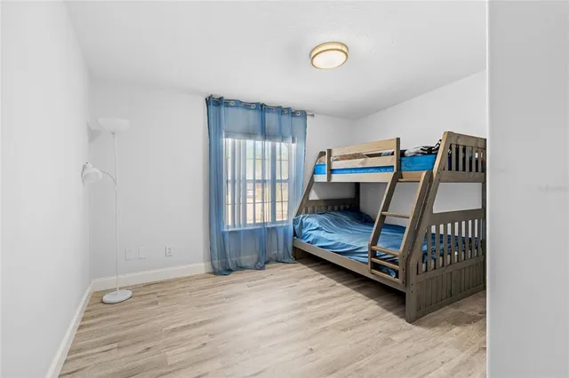 a bedroom with furniture and window