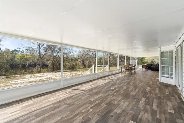 a view of an empty room and a balcony