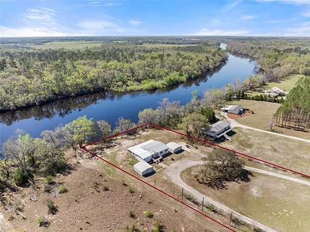 an aerial view of lake residential house with outdoor space