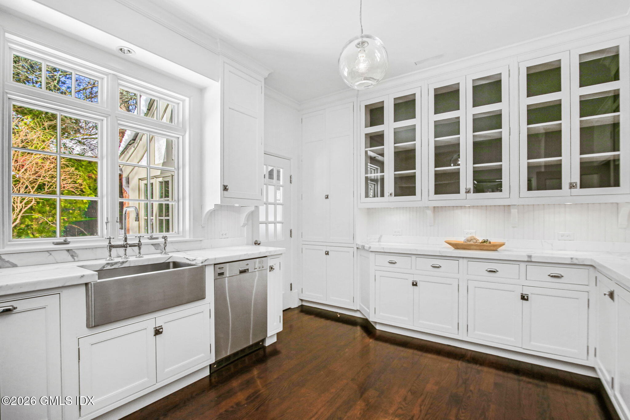 164 Round Hill Road Greenwich, CT 06831 - Photo 18 of 67 a kitchen with granite countertop a sink and cabinets