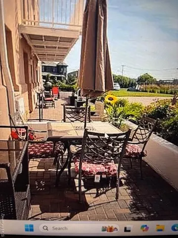 a view of swimming pool with outdoor seating and plants