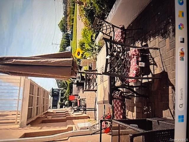 a view of swimming pool with outdoor seating and plants