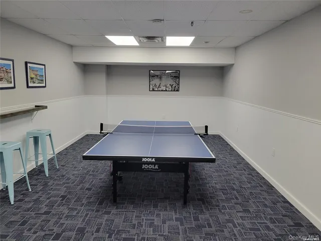 a view of a room with furniture and wooden floor
