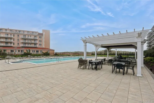 a view of outdoor space with swimming pool and furniture