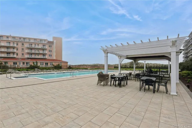 a view of outdoor space with swimming pool and furniture