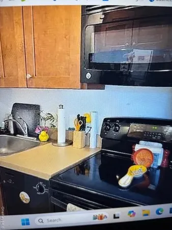 a kitchen with a stove and a sink