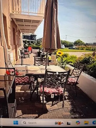 a view of swimming pool with outdoor seating and plants