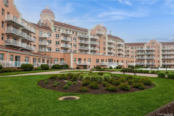 a view of a building with a yard