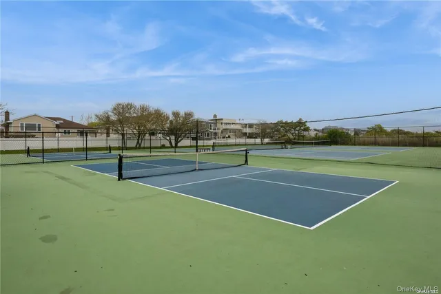 a view of an outdoor space and tennis court