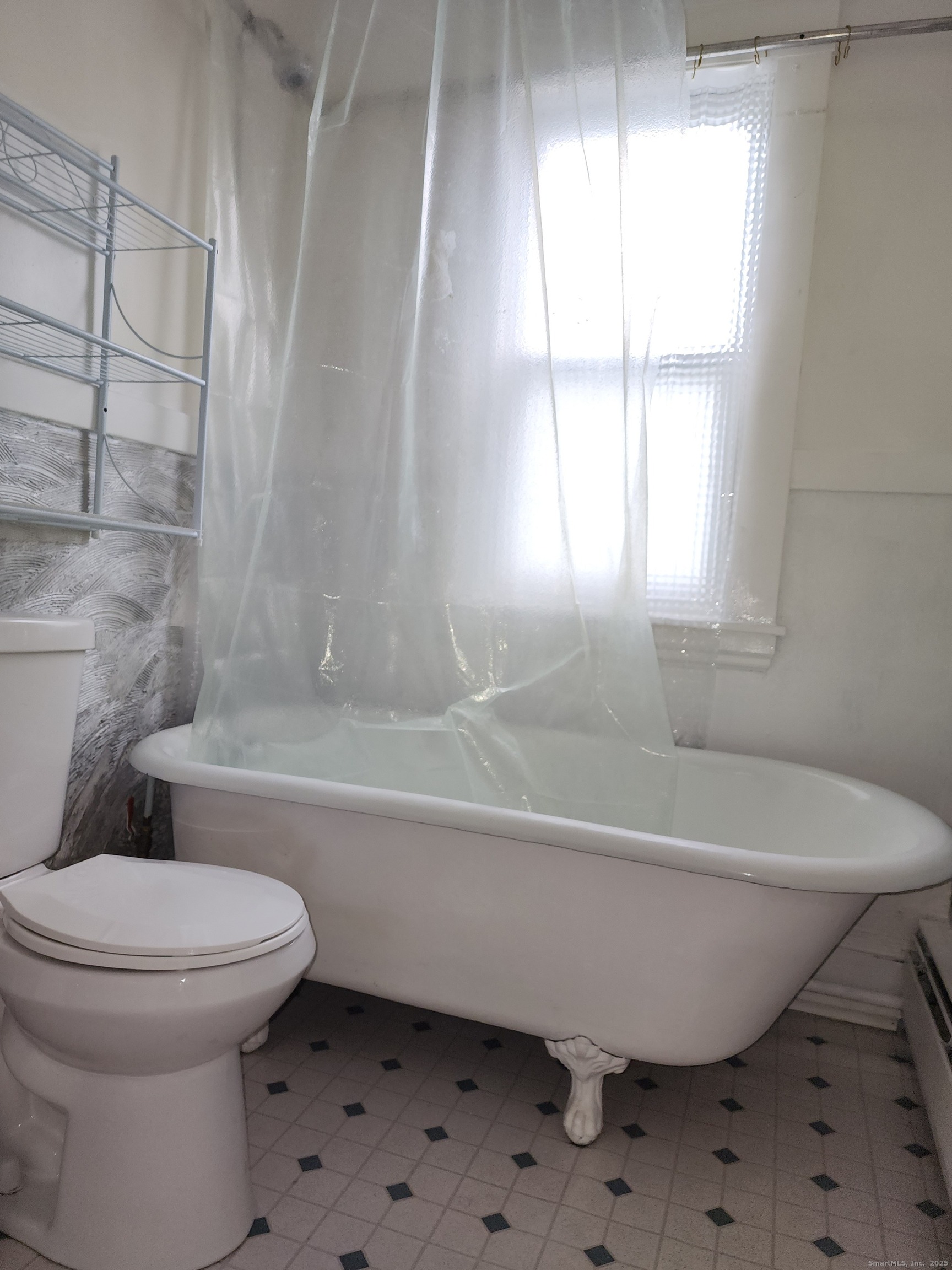 106 Lyons Street New Britain, CT 06052 - Photo 20 of 24 a bathroom with a toilet and bathtub