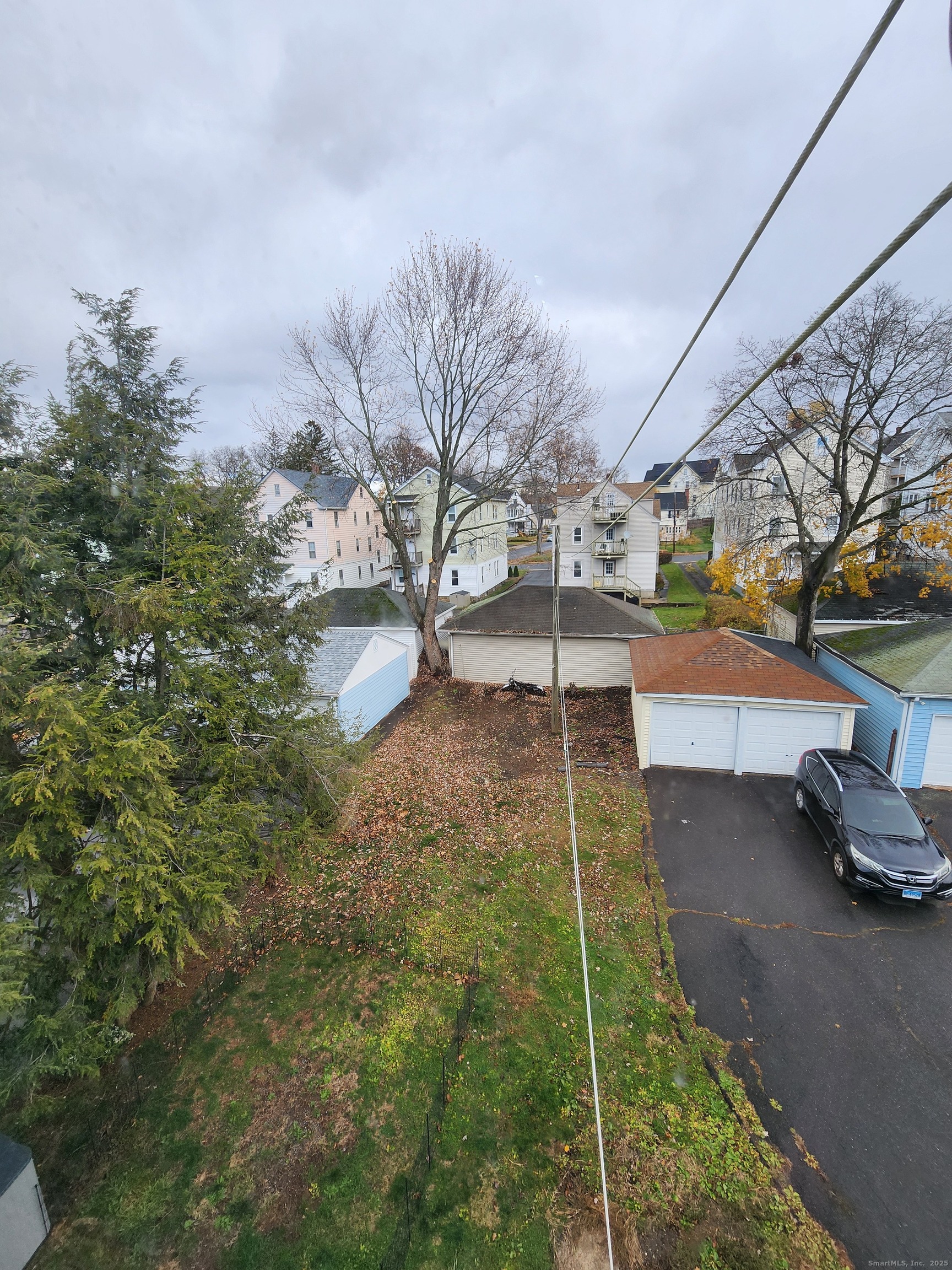 106 Lyons Street New Britain, CT 06052 - Photo 24 of 24 a backyard of a house with lots of green space