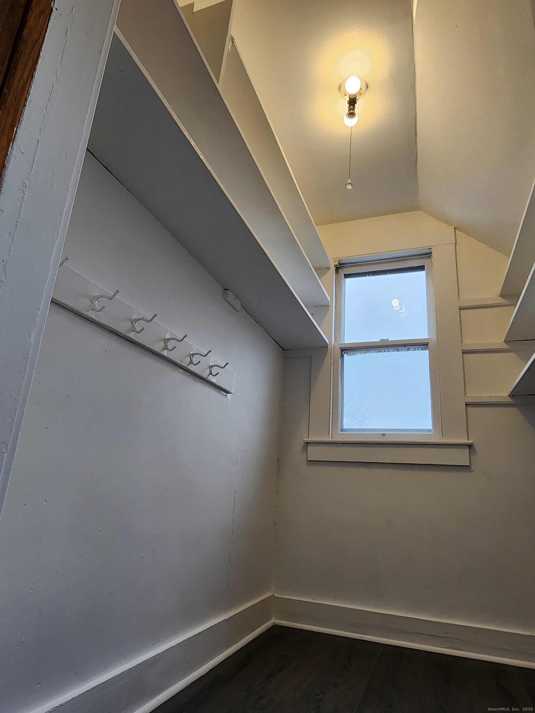 106 Lyons Street New Britain, CT 06052 - Photo 6 of 24 a view of a small space with wooden floor and a window