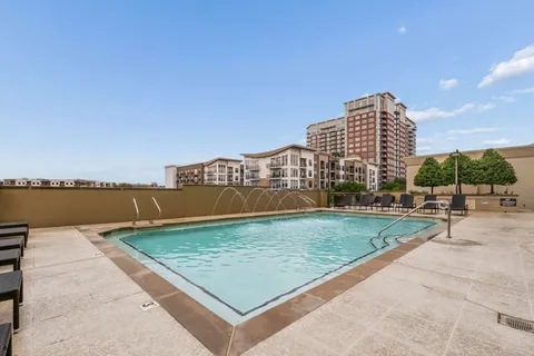 a view of a swimming pool with a terrace