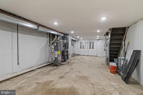 a view of a balcony with wooden floor and iron fence