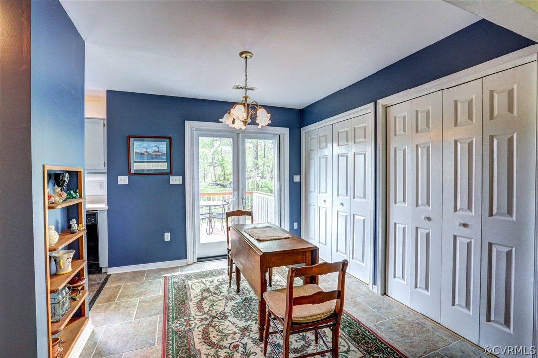 4151 Broad St Road Gum Spring, VA 23065 - Photo 11 of 38 a living room with furniture and a chandelier