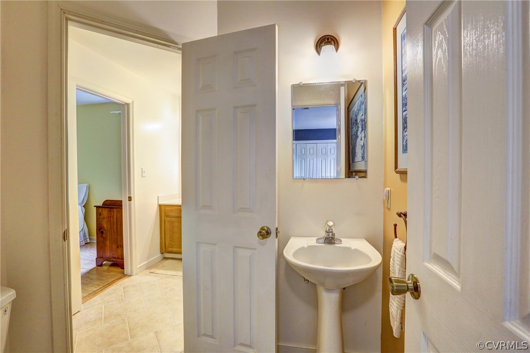 4151 Broad St Road Gum Spring, VA 23065 - Photo 17 of 38 a bathroom with a sink and a mirror