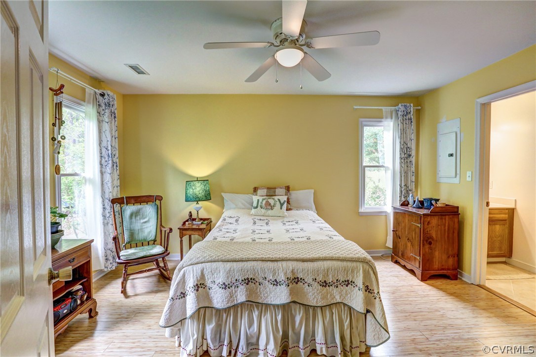 4151 Broad St Road Gum Spring, VA 23065 - Photo 20 of 38 a bedroom with a bed and wooden floor