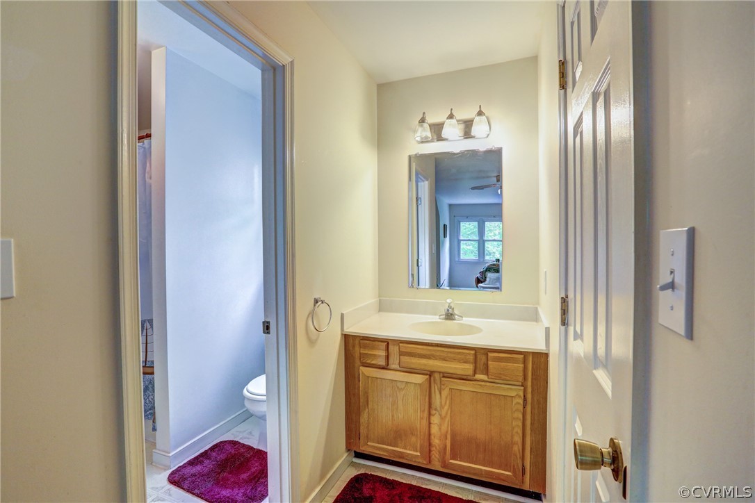 4151 Broad St Road Gum Spring, VA 23065 - Photo 25 of 38 a bathroom with a sink and a mirror