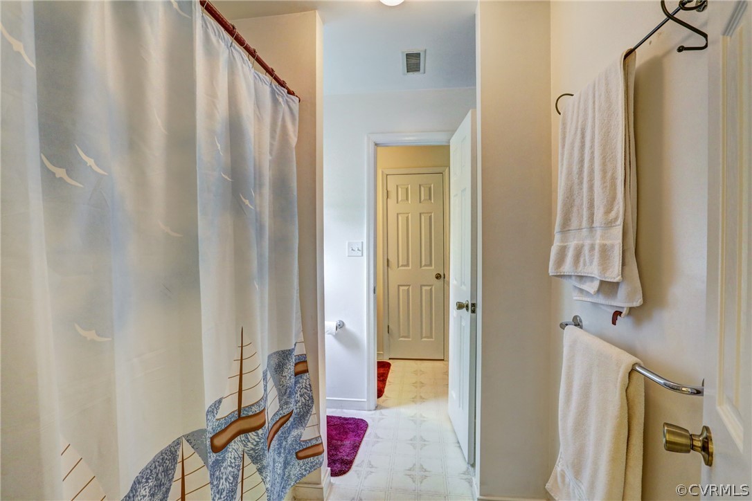 4151 Broad St Road Gum Spring, VA 23065 - Photo 27 of 38 a bathroom with a bathtub and shower