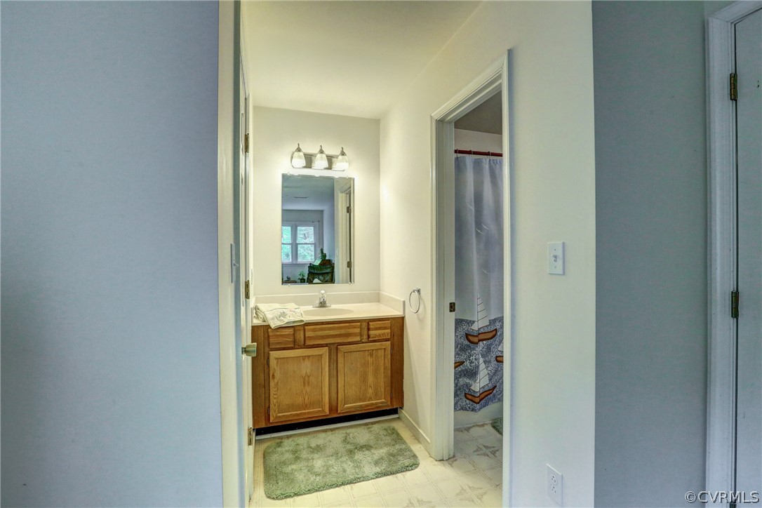4151 Broad St Road Gum Spring, VA 23065 - Photo 28 of 38 a bathroom with a granite countertop sink and a mirror