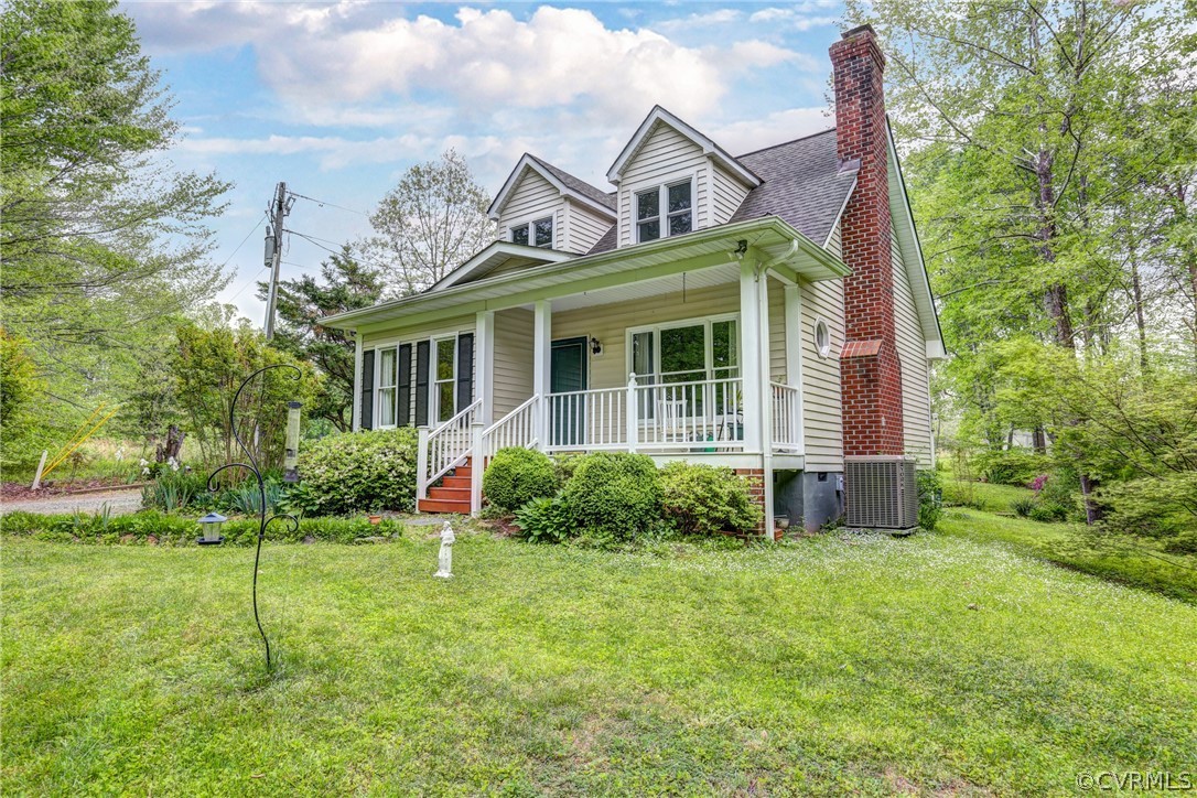 4151 Broad St Road Gum Spring, VA 23065 - Photo 3 of 38 a front view of a house with garden