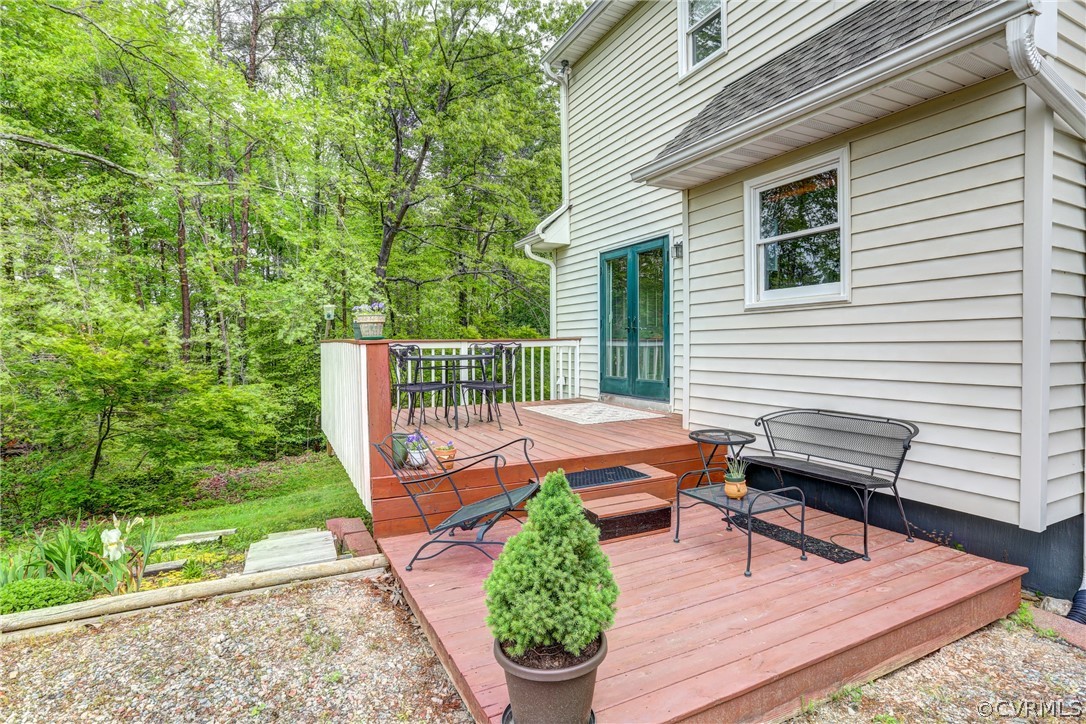 4151 Broad St Road Gum Spring, VA 23065 - Photo 33 of 38 a balcony with wooden floor table and chairs