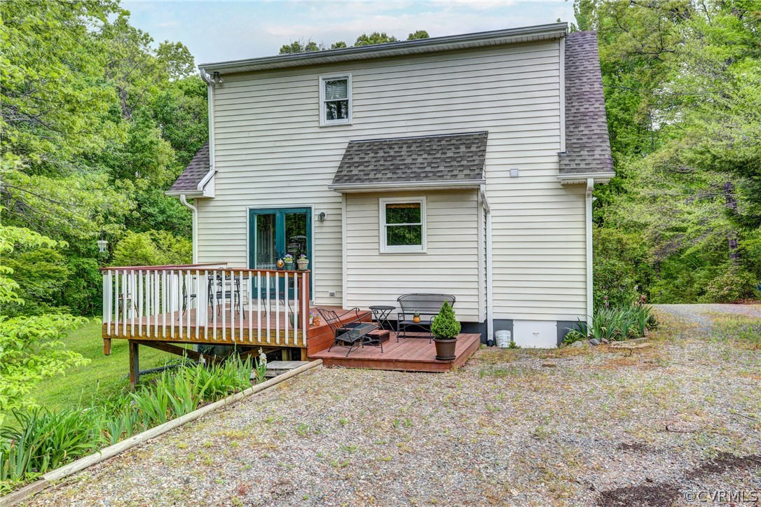 4151 Broad St Road Gum Spring, VA 23065 - Photo 37 of 38 a view of a house with a small yard and deck