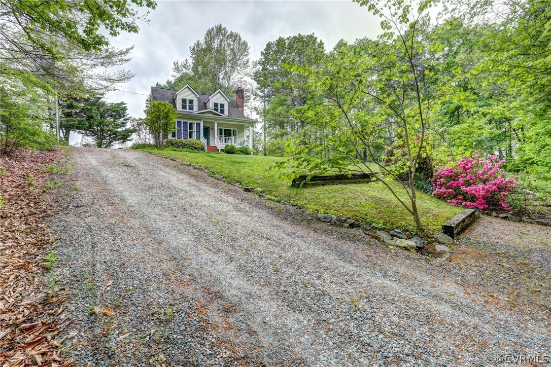 4151 Broad St Road Gum Spring, VA 23065 - Photo 5 of 38 a front view of a house with a yard garage and outdoor seating