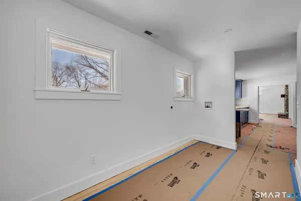 a view of a livingroom with a lounge chair