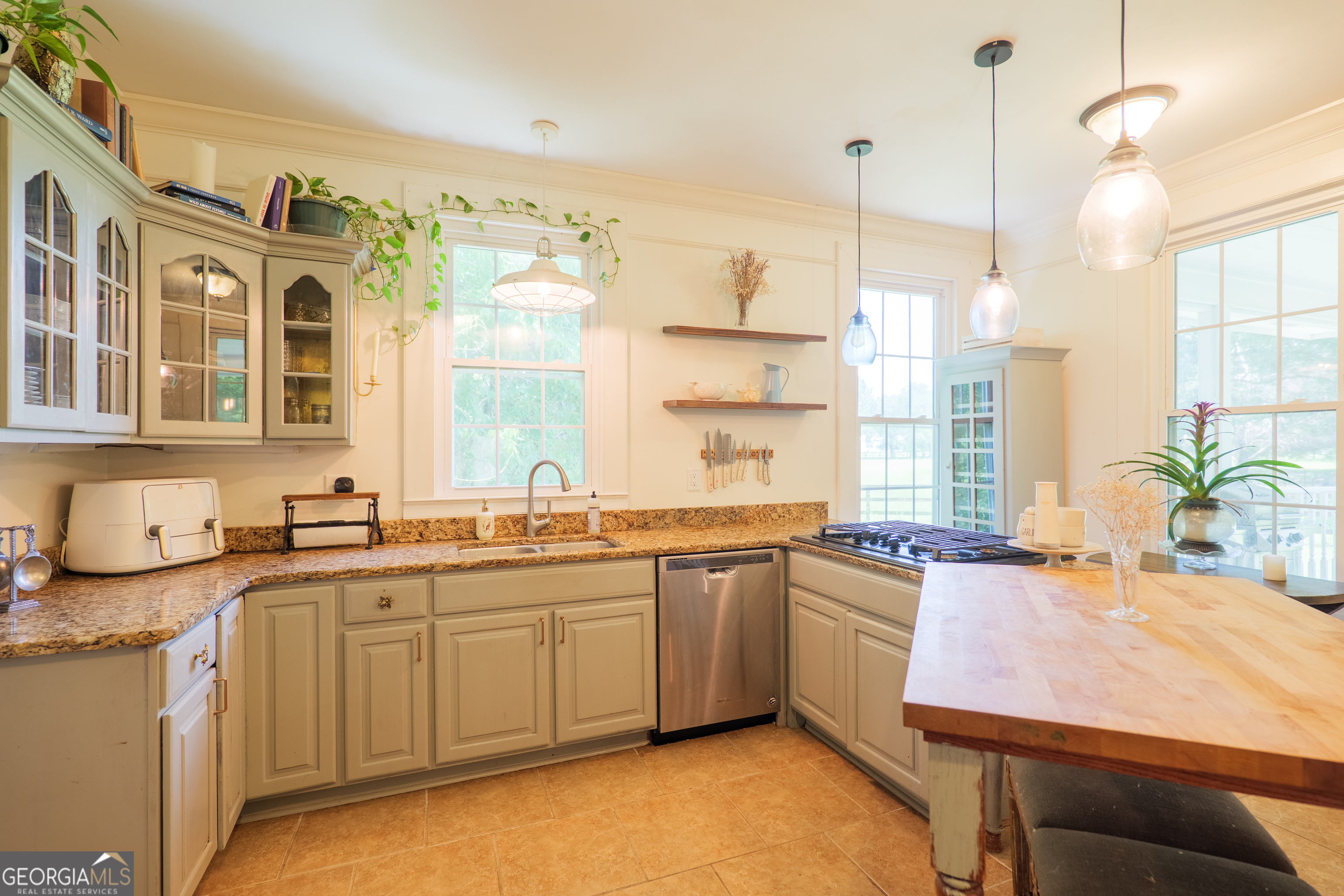 7552 Webb Road Hahira, GA 31632 - Photo 17 of 57 a kitchen with a sink stove and window