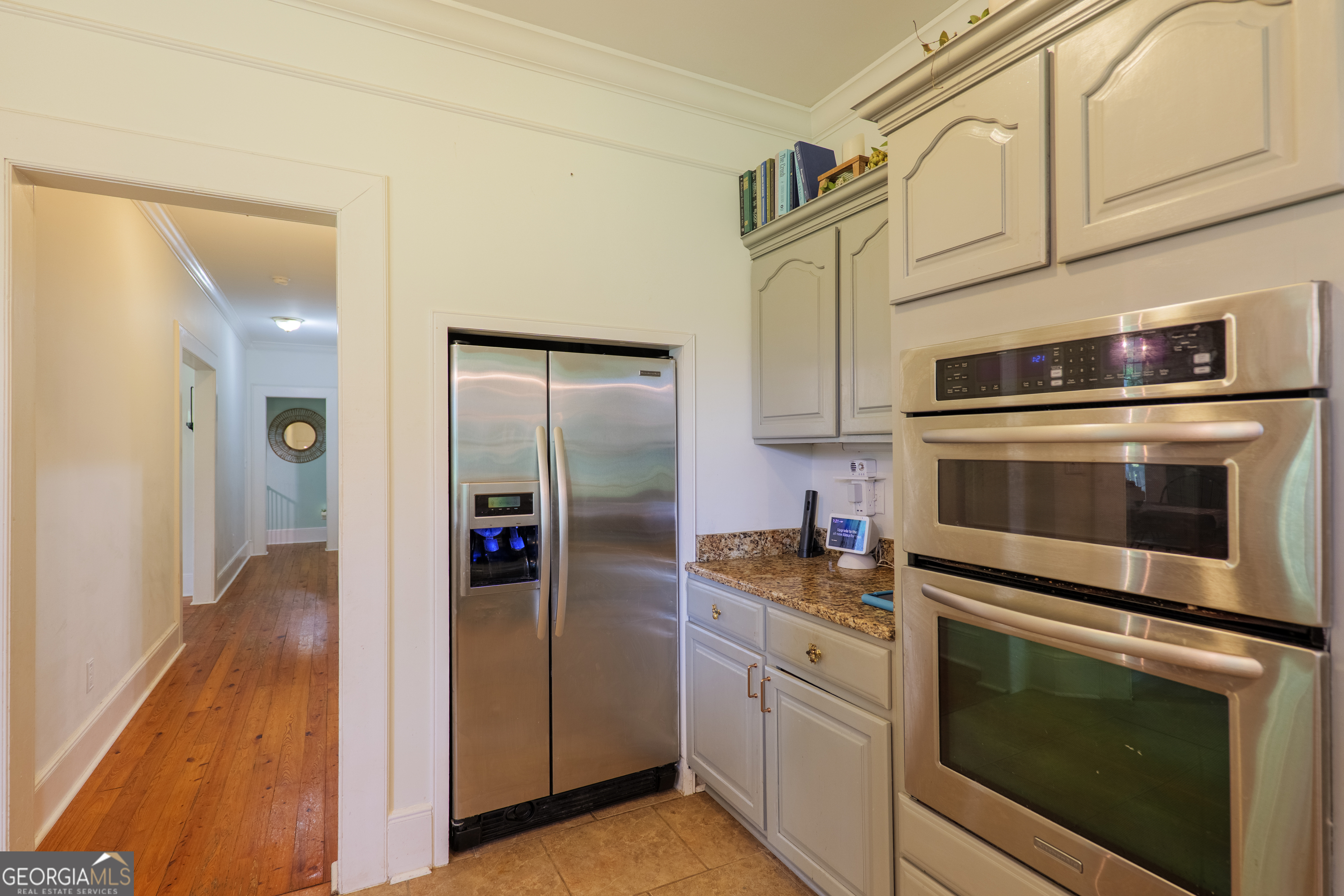 7552 Webb Road Hahira, GA 31632 - Photo 20 of 57 a kitchen with stainless steel appliances white cabinets and a stove