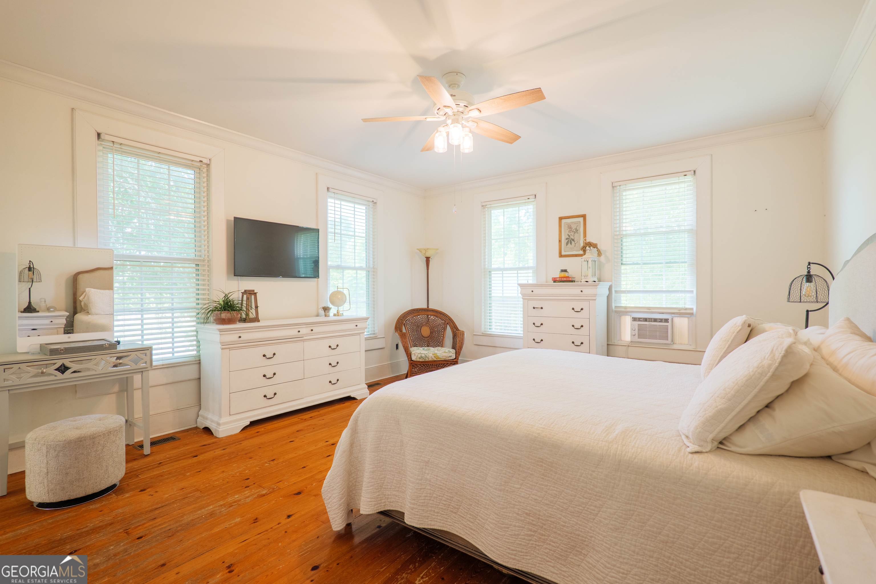 7552 Webb Road Hahira, GA 31632 - Photo 21 of 57 a bedroom with a bed and a flat screen tv