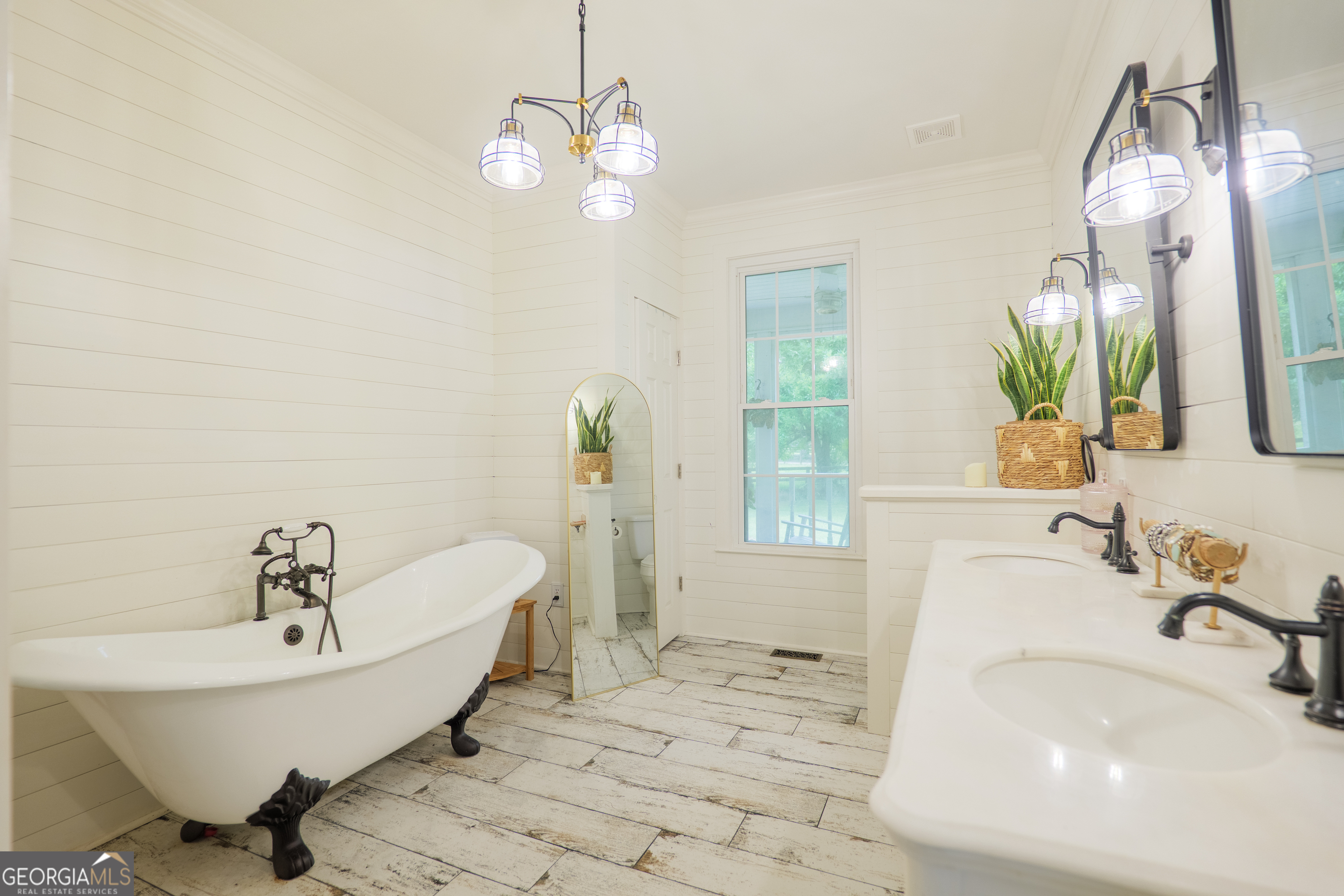 7552 Webb Road Hahira, GA 31632 - Photo 23 of 57 a spacious bathroom with a sink and a mirror